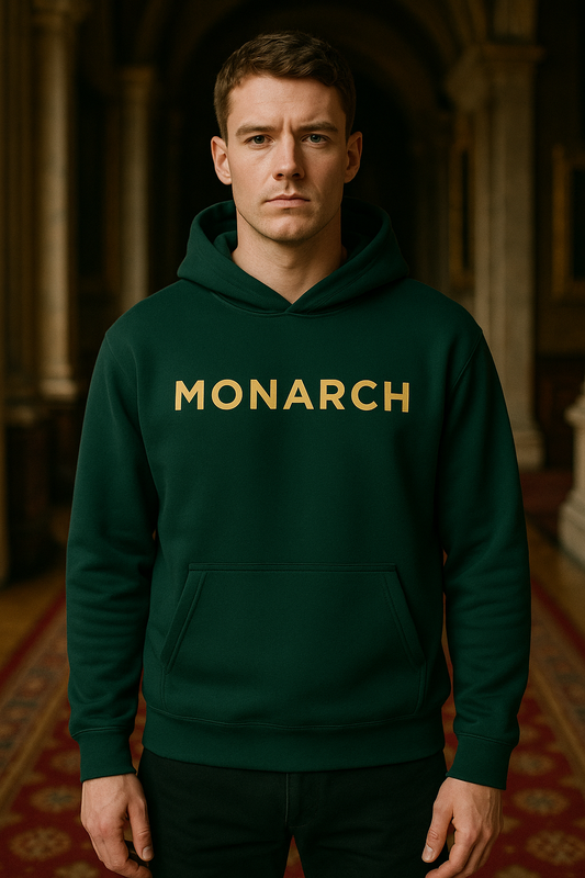 A confident British man wearing the MONARCH hoodie with poise and presence.