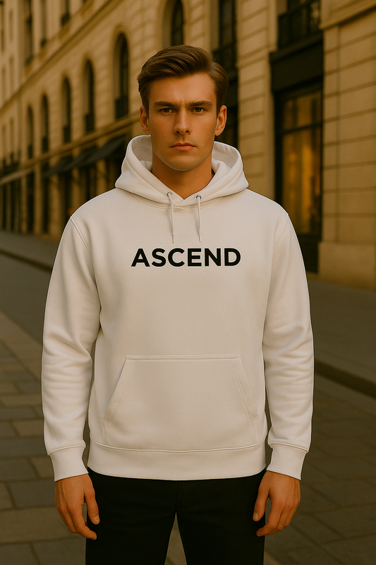Male model wearing ASCEND white hoodie in Parisian street, styled by Desmond & Florence.