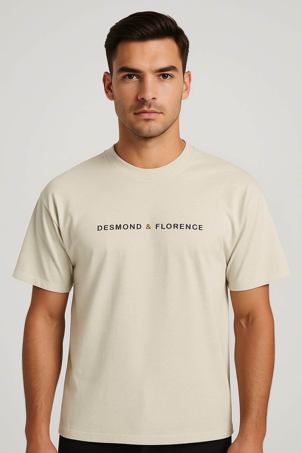 Male model wearing Desmond & Florence faded bone tee, front view in studio lighting